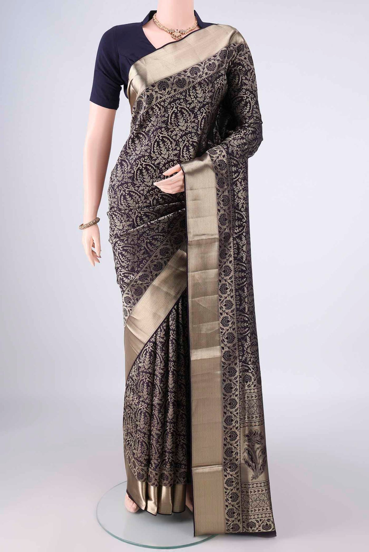 Pure Silk Navy Blue Soft Saree with Zari Brocade on the body and Zari Border.  displayed on a mannequin