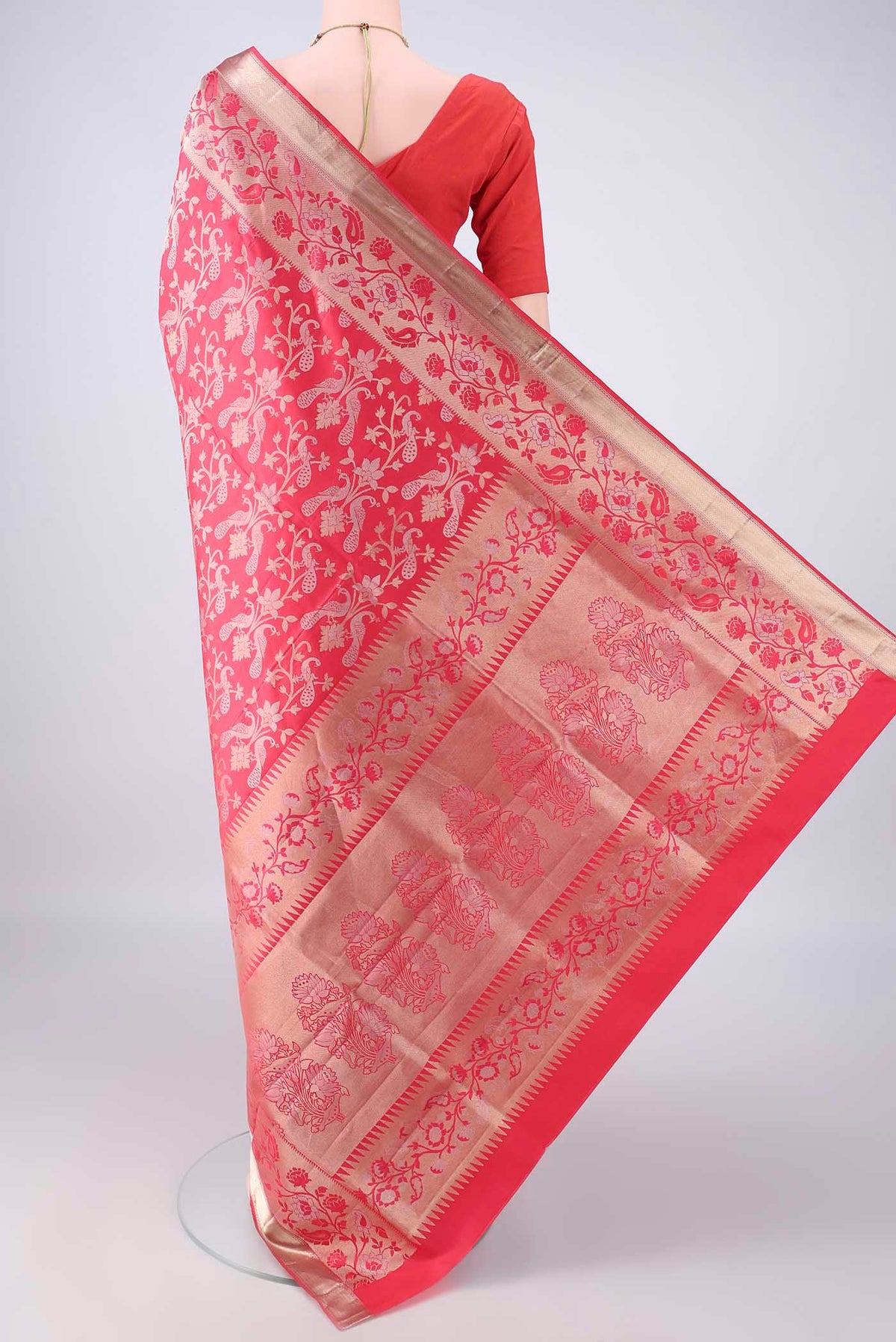 Flat view of Pure Silk Coral Soft Saree with Zari Brocade on the body and Zari Border. 