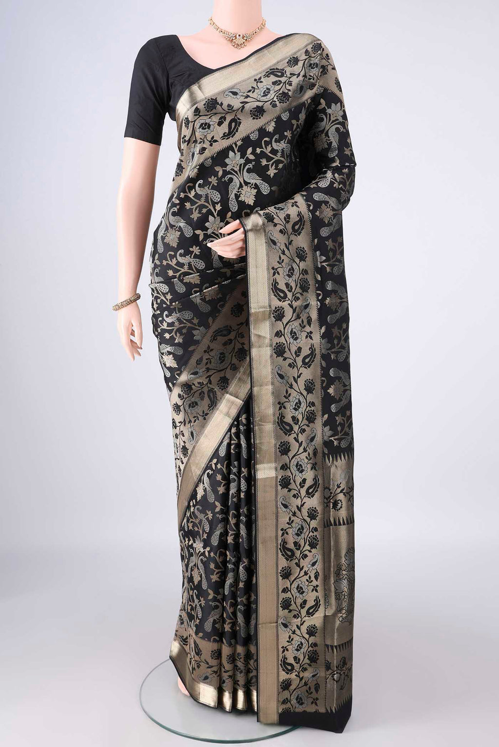 Pure Silk Black Soft Saree with Zari Brocade on the body and Zari Border.  displayed on a mannequin