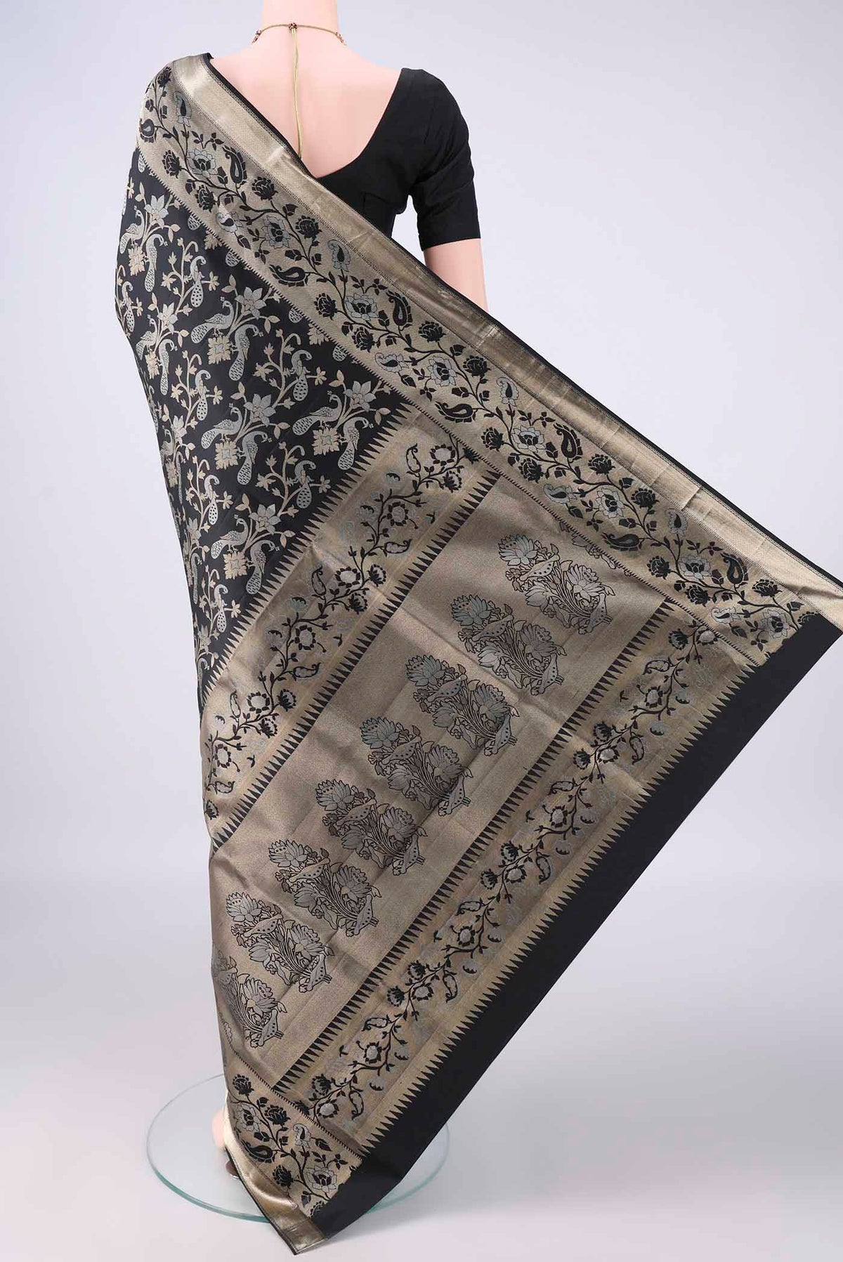 Flat view of Pure Silk Black Soft Saree with Zari Brocade on the body and Zari Border. 
