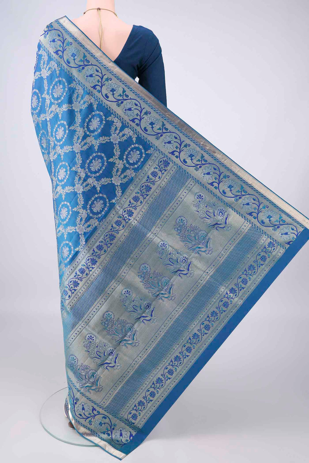 Flat view of Pure Silk Peacock Blue Soft Saree with Zari Brocade on the body and Zari Border. 