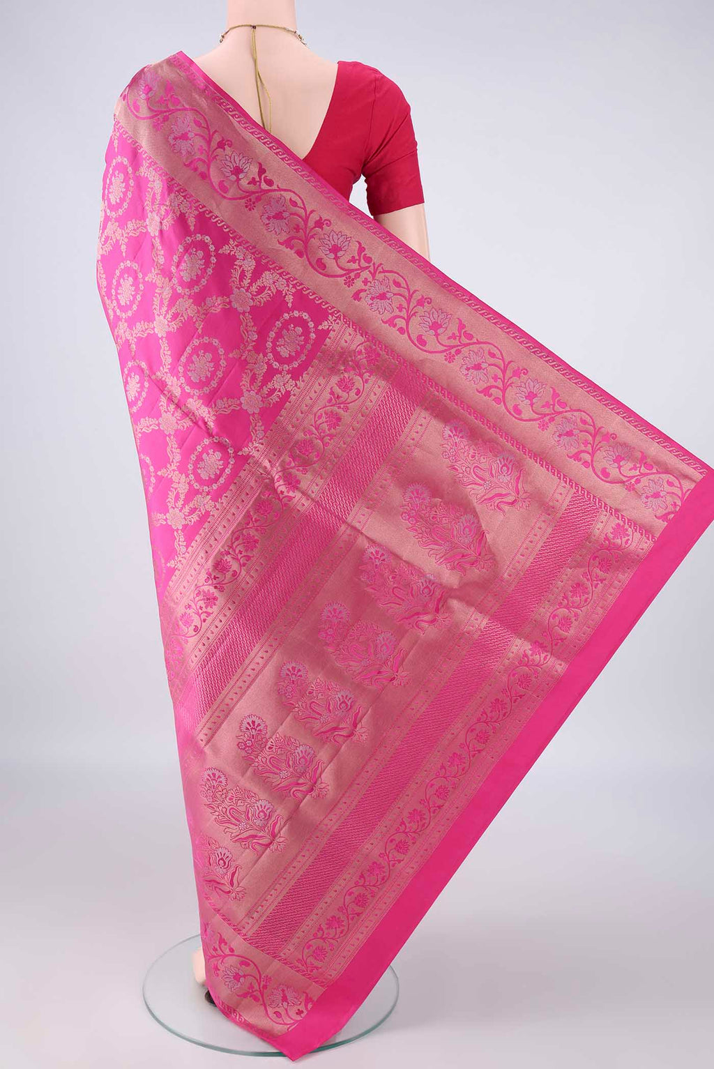 Flat view of Pure Silk Rani Pink Soft Saree with Zari Brocade on the body and Zari Border. 