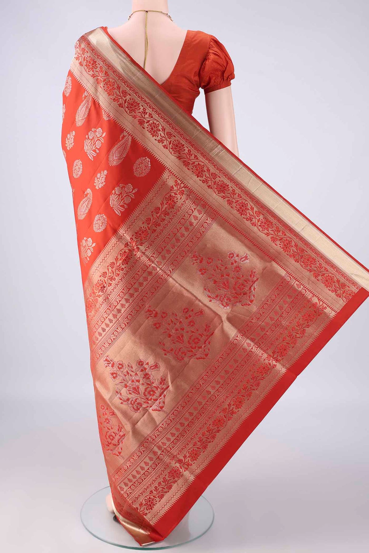 Flat view of Pure Silk Brick Orange Soft Saree with Zari Brocade on the body and Zari Border. 