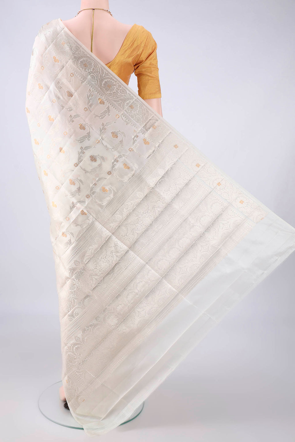 Flat view of Pure Silk Off White Banarasi Raw Saree with Zari Butta on the body and Zari Border. 