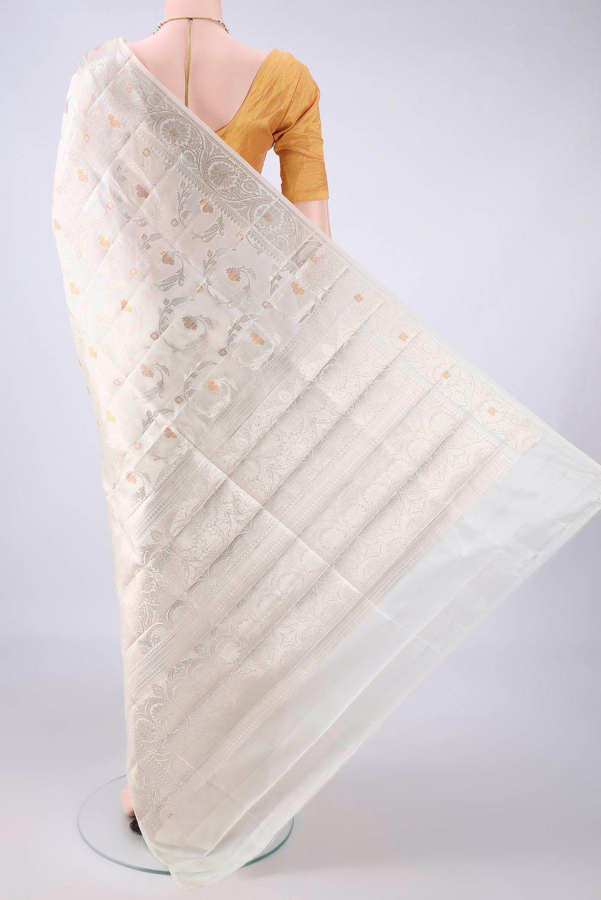 Flat view of Pure Silk Off White Banarasi Raw Saree with Zari Butta on the body and Zari Border. 