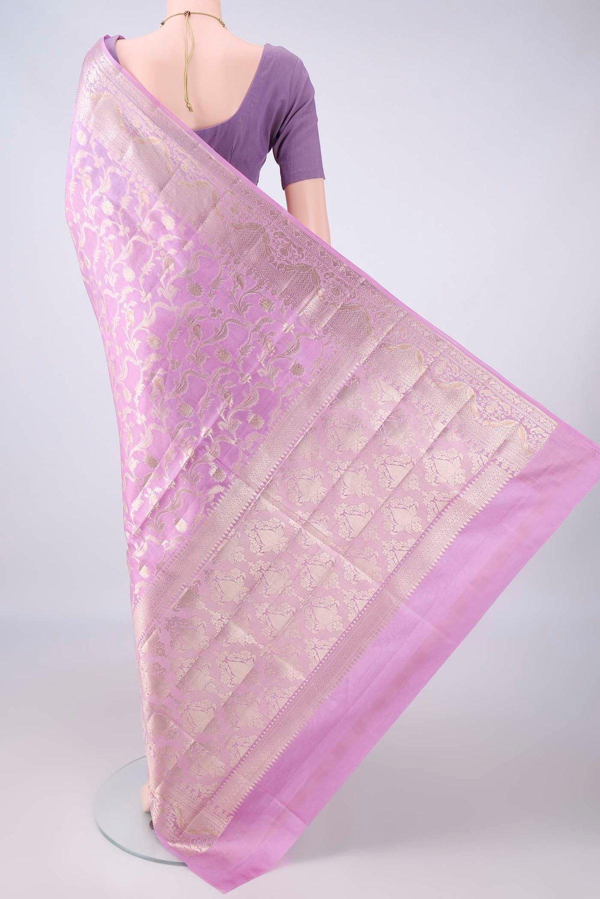Flat view of Pure Silk Lavender Banarasi Raw Saree with Zari Butta on the body and Zari Border. 