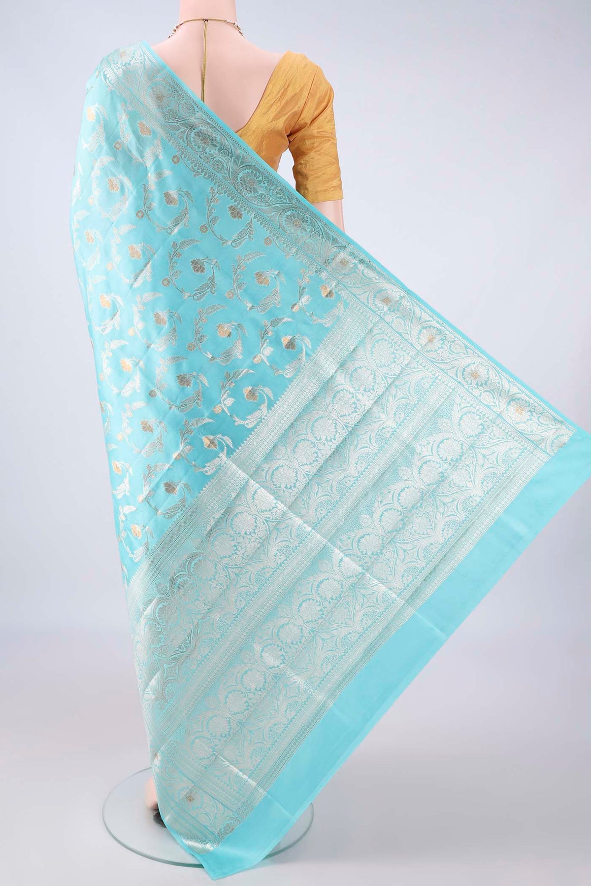 Flat view of Pure Silk Sky Blue Banarasi Raw Saree with Zari Butta on the body and Zari Border. 