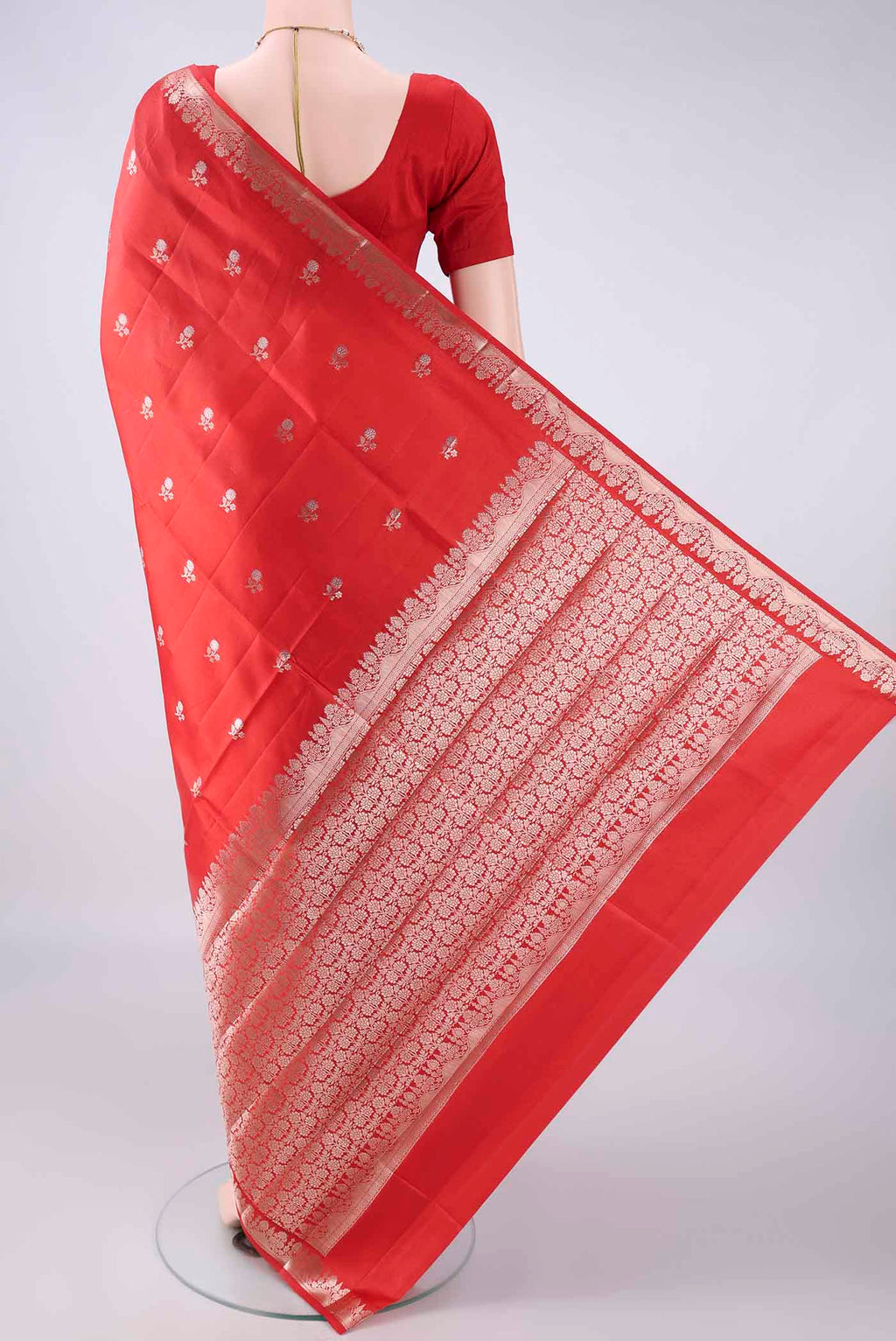 Flat view of Pure Silk Red Banarasi Raw Saree with Zari Butta on the body and Zari Border. 