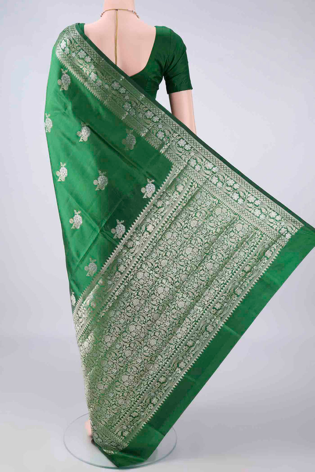 Flat view of Pure Silk Green Banarasi Raw Saree with Zari Butta on the body and Zari Border. 
