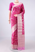 Pure Silk Rani Pink Banarasi Raw Saree with Zari Brocade on the body and Zari Border.  displayed on a mannequin