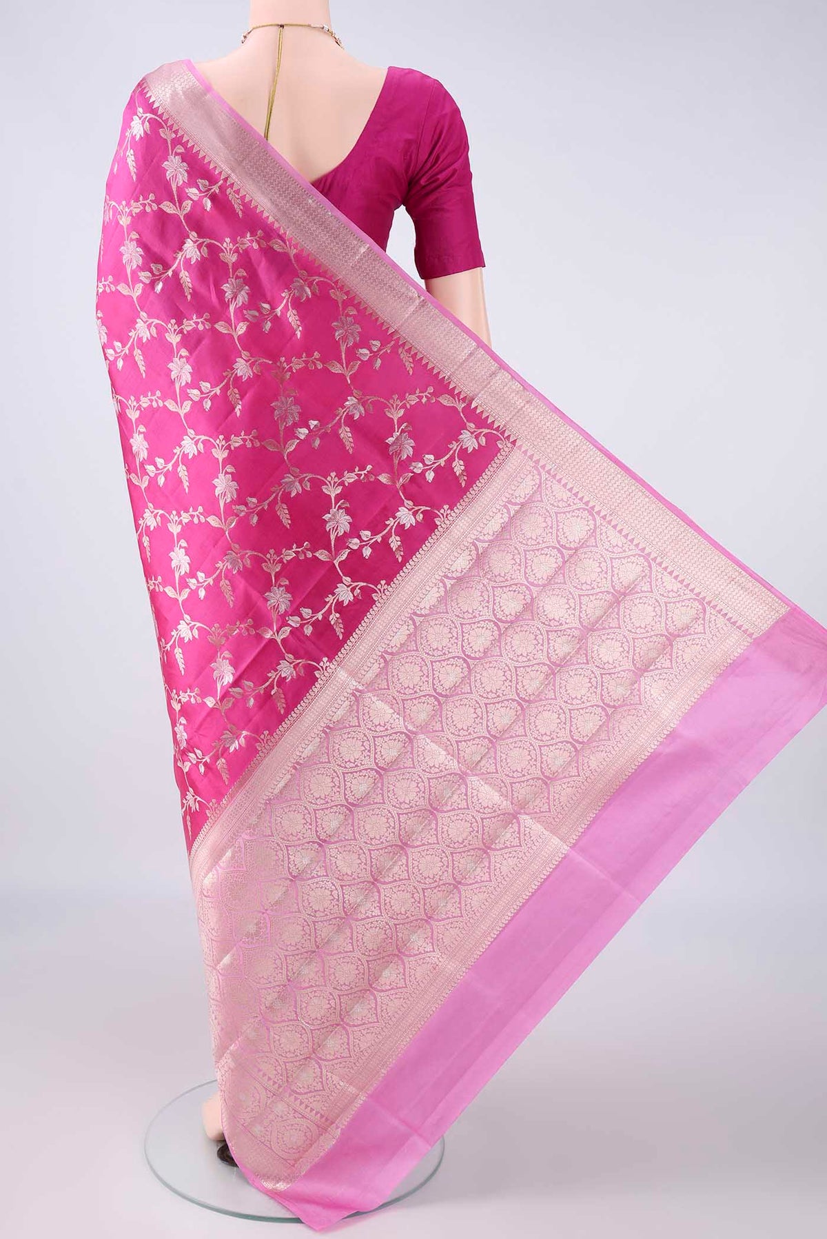 Flat view of Pure Silk Rani Pink Banarasi Raw Saree with Zari Brocade on the body and Zari Border. 