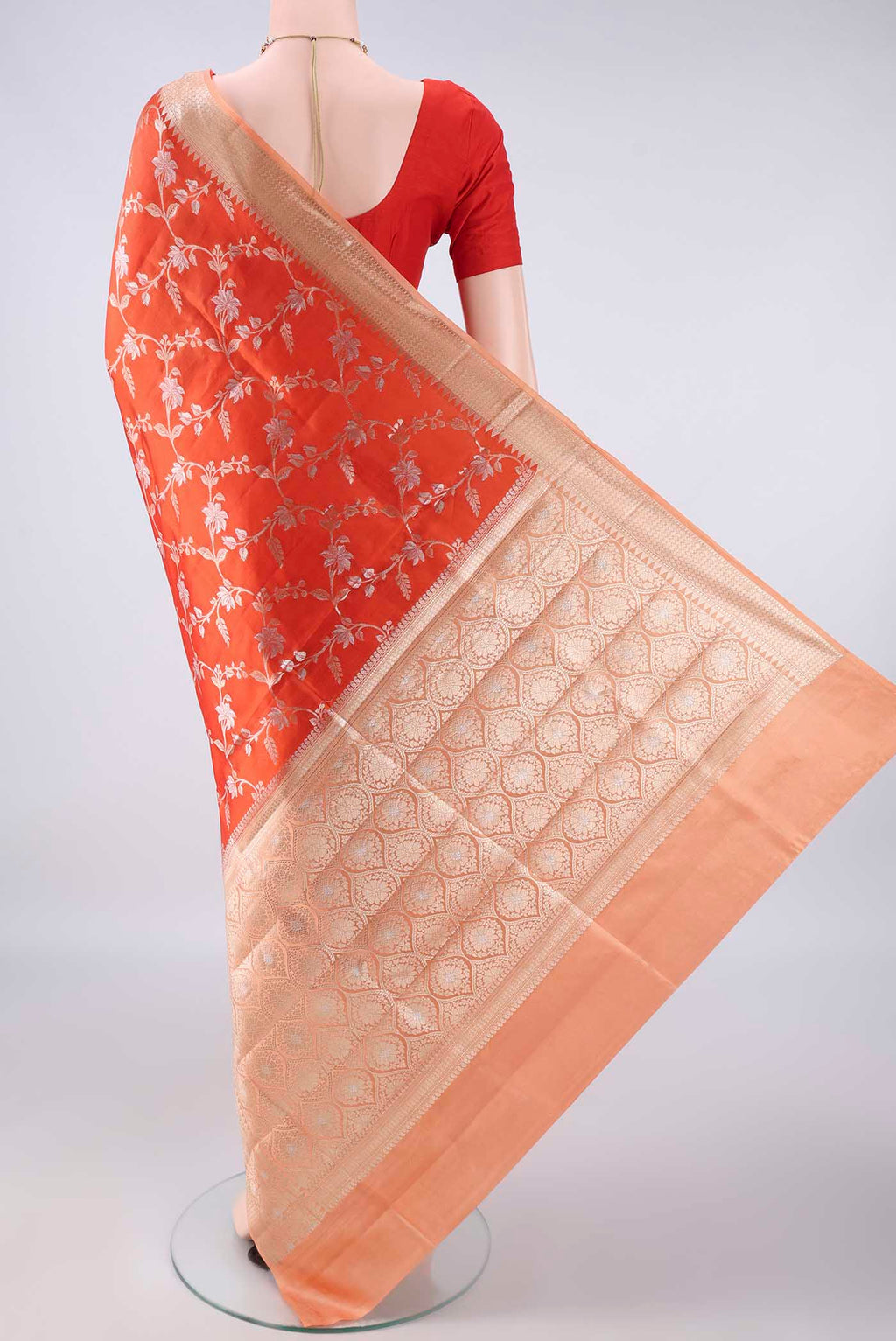 Flat view of Pure Silk Orange Banarasi Raw Saree with Zari Brocade on the body and Zari Border. 