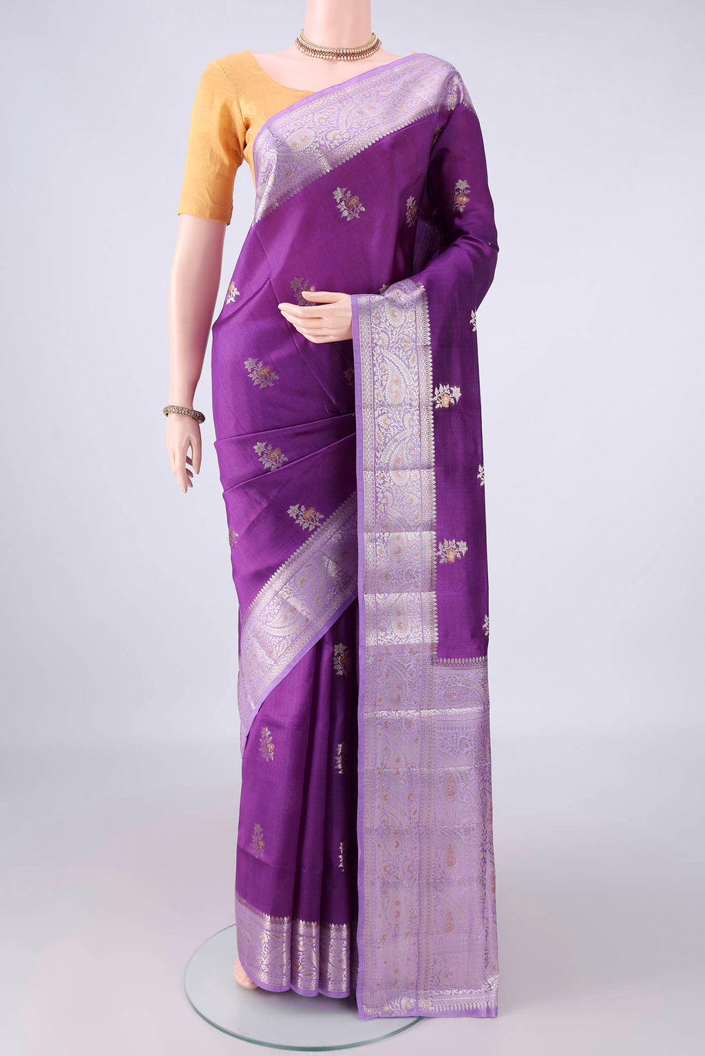 Pure Silk Purple Banarasi Raw Saree with Zari Brocade on the body and Zari Border.  displayed on a mannequin