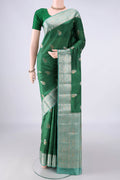 Pure Silk Bottle Green Banarasi Raw Saree with Zari Brocade on the body and Zari Border.  displayed on a mannequin