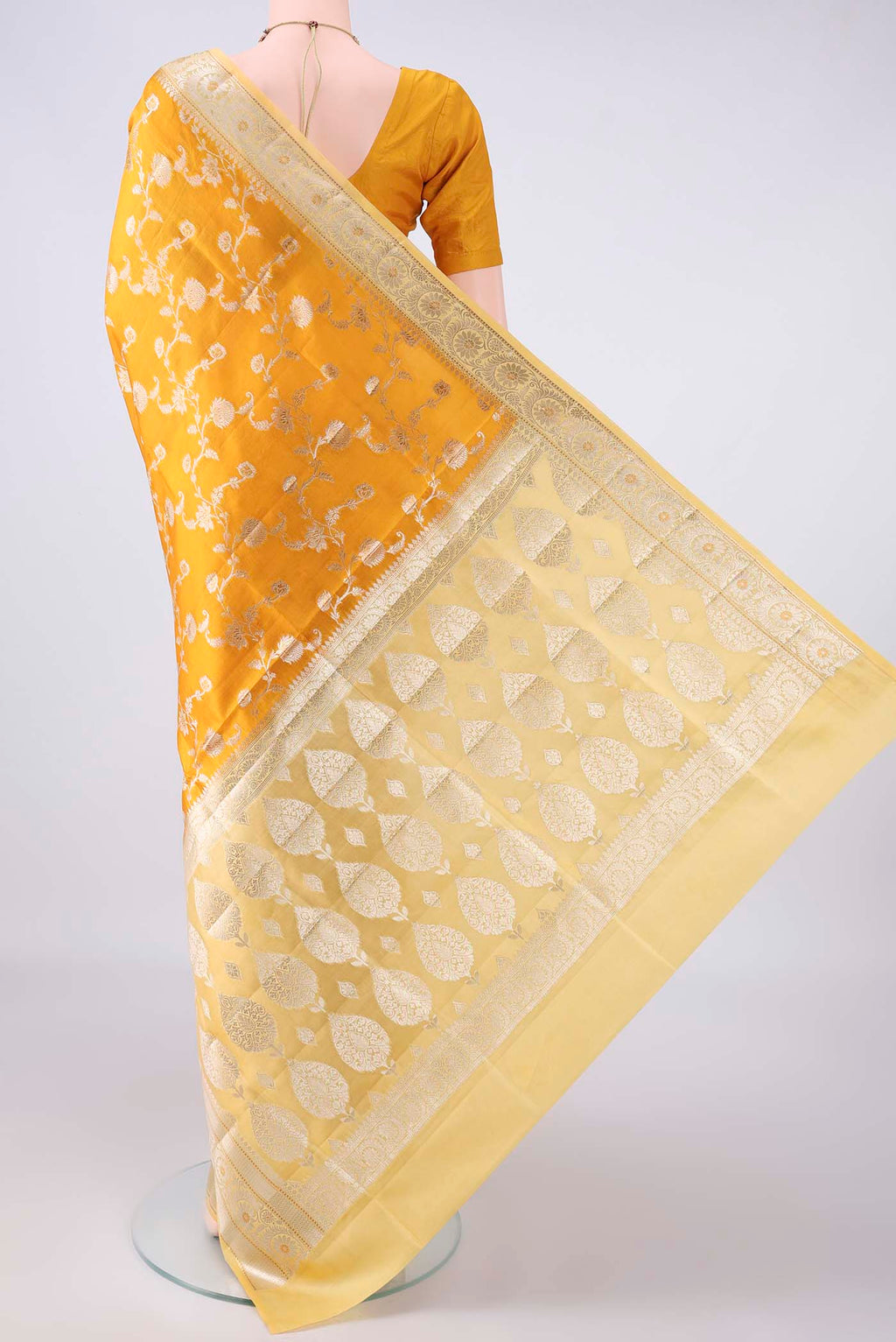 Flat view of Pure Silk Yellow Banarasi Raw Saree with Zari Brocade on the body and Zari Border. 