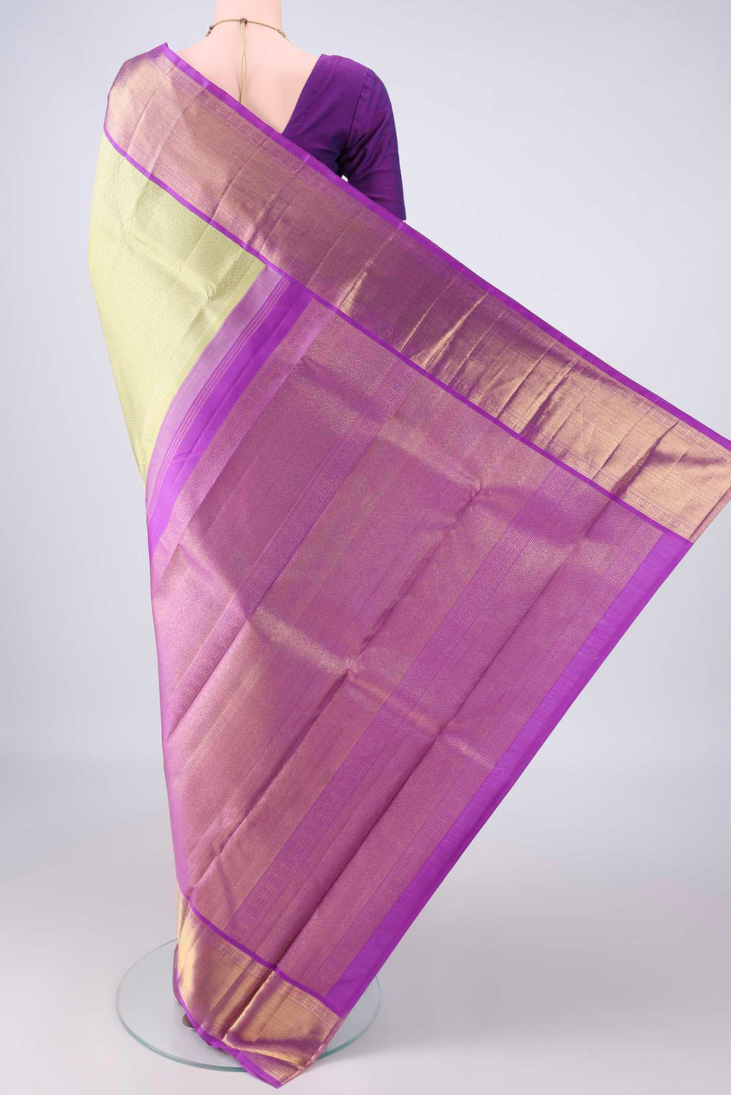 Flat view of Pure Silk Pure Zari Pista Green Kanjivaram Saree with Jacquard design on the body and Zari Border. 
