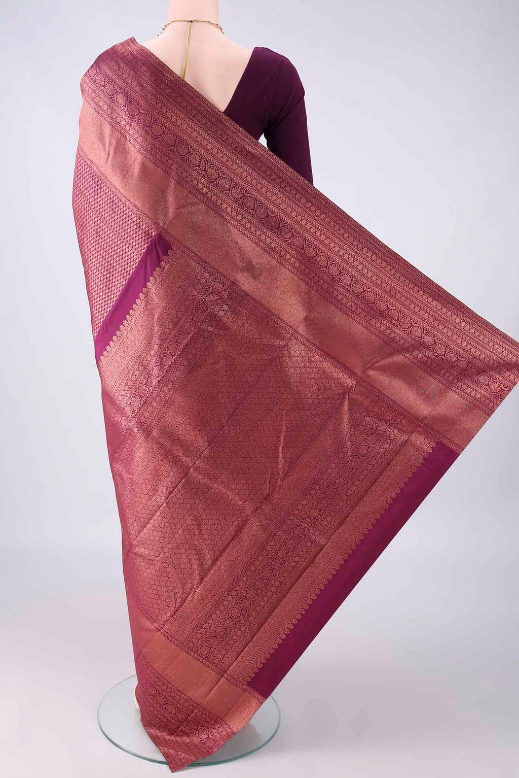 Flat view of Pure Silk Magenta Kanchipuram Saree with Zari Brocade on the body and Zari Border. 