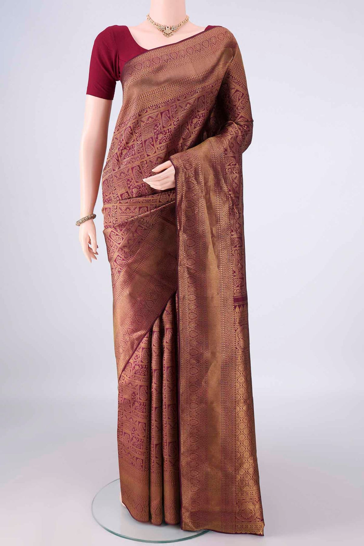 Pure Silk Magenta Dual Tone Kanchipuram Saree with Zari Brocade on the body and Zari Border.  displayed on a mannequin