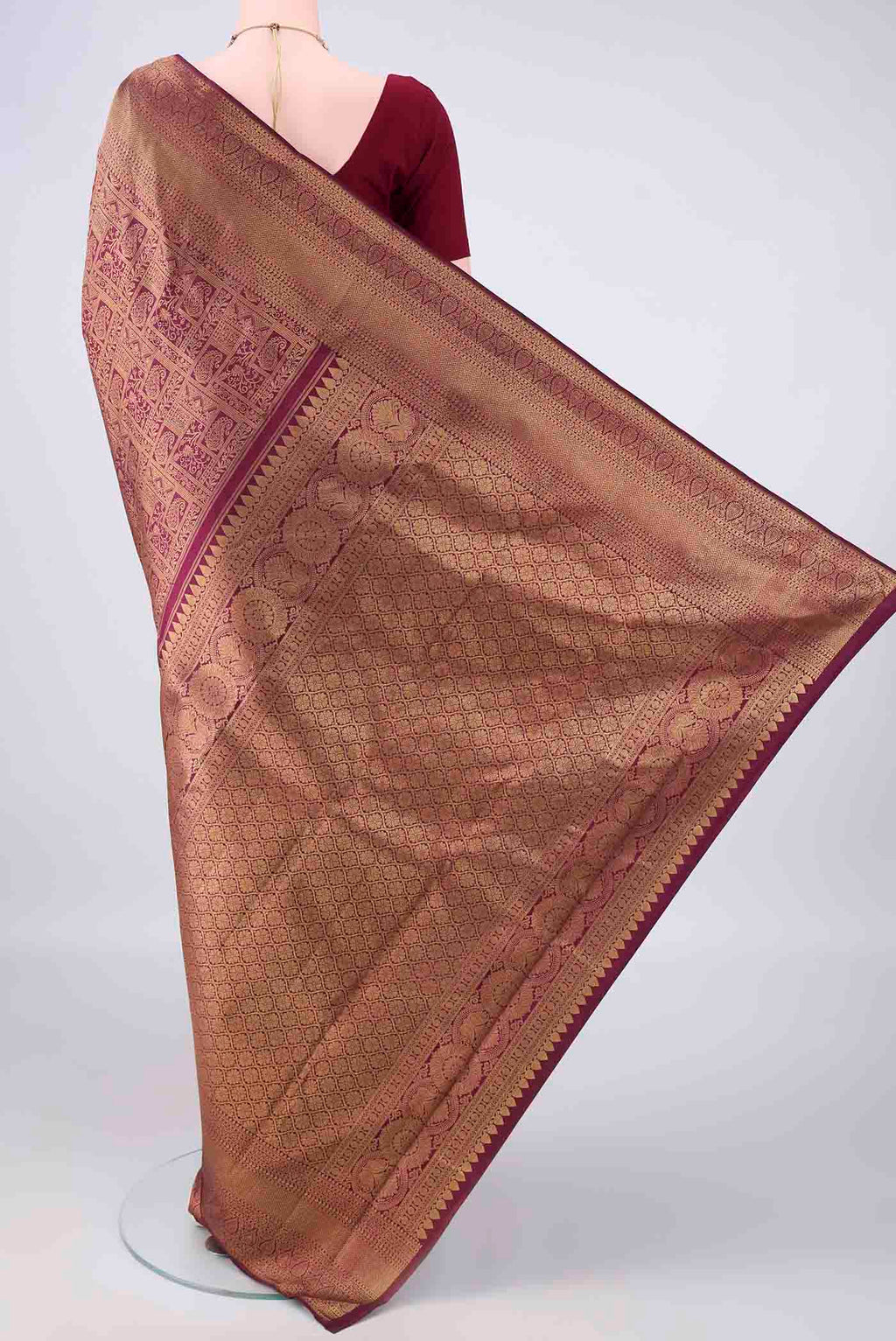 Flat view of Pure Silk Magenta Dual Tone Kanchipuram Saree with Zari Brocade on the body and Zari Border. 
