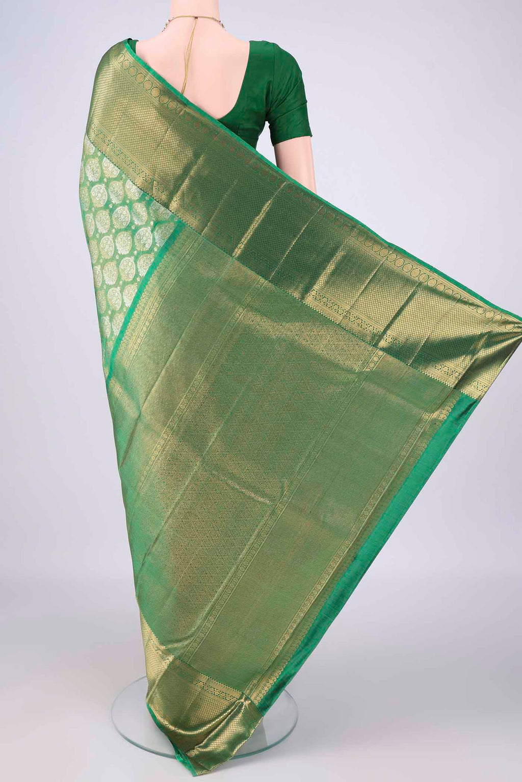 Flat view of Green Dual Tone Kanjivaram Tissue Saree with Zari Brocade on the body and Zari Border. 