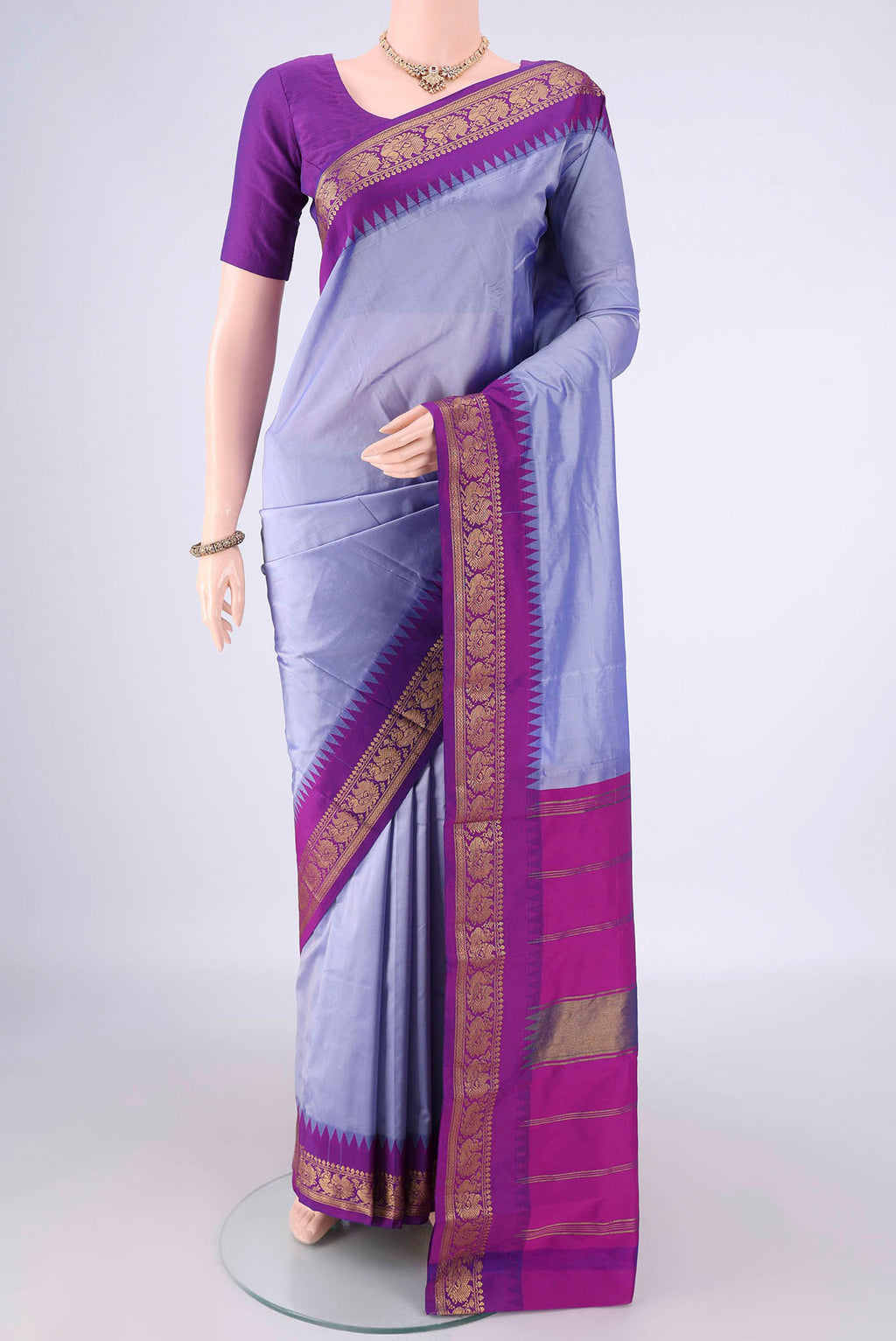 Light Blue Blended Bangalore Silk Saree with Plain Body and Zari Border.  displayed on a mannequin
