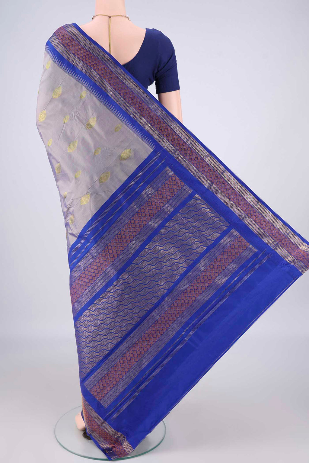 Flat view of Grey Blended Bangalore Silk Saree with Zari Butta on the body and Zari Border. 
