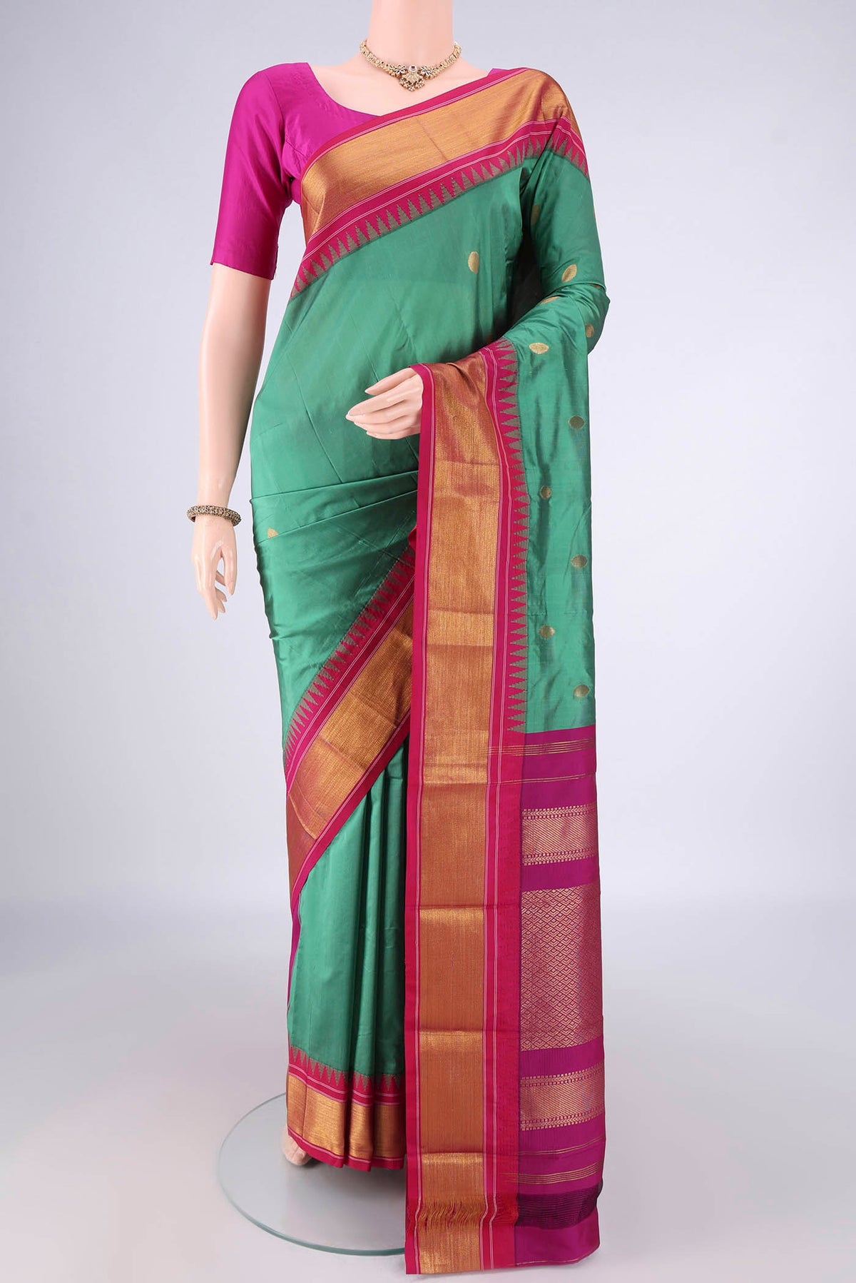 Light Green Blended Bangalore Silk Saree with Zari Butta on the body and Zari Border.  displayed on a mannequin