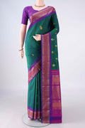 Bottle Green Blended Bangalore Silk Saree with Zari Butta on the body and Zari Border.  displayed on a mannequin