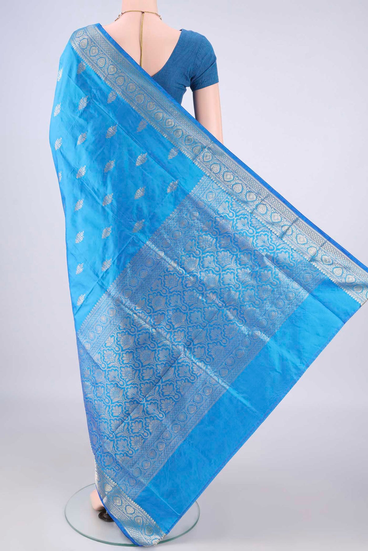 Flat view of Pure Silk Electric Blue Banarasi Katan Saree with Zari Butta on the body and Zari Border. 