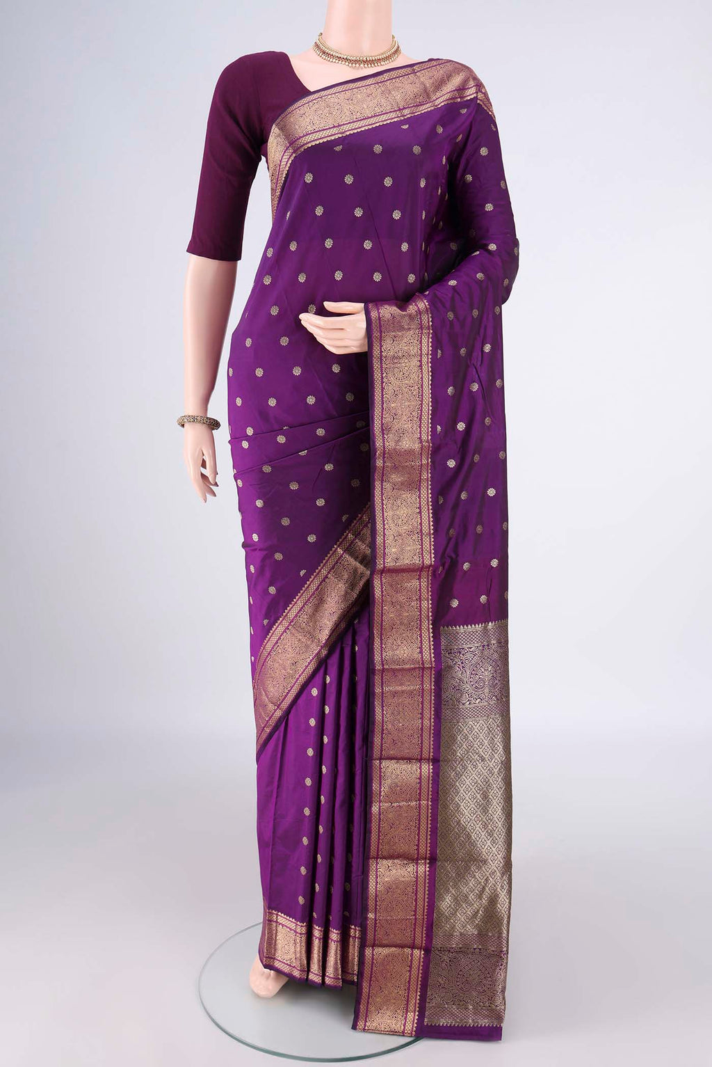 Purple Blended Bangalore Silk Saree with Zari Butta on the body and Zari Border.  displayed on a mannequin