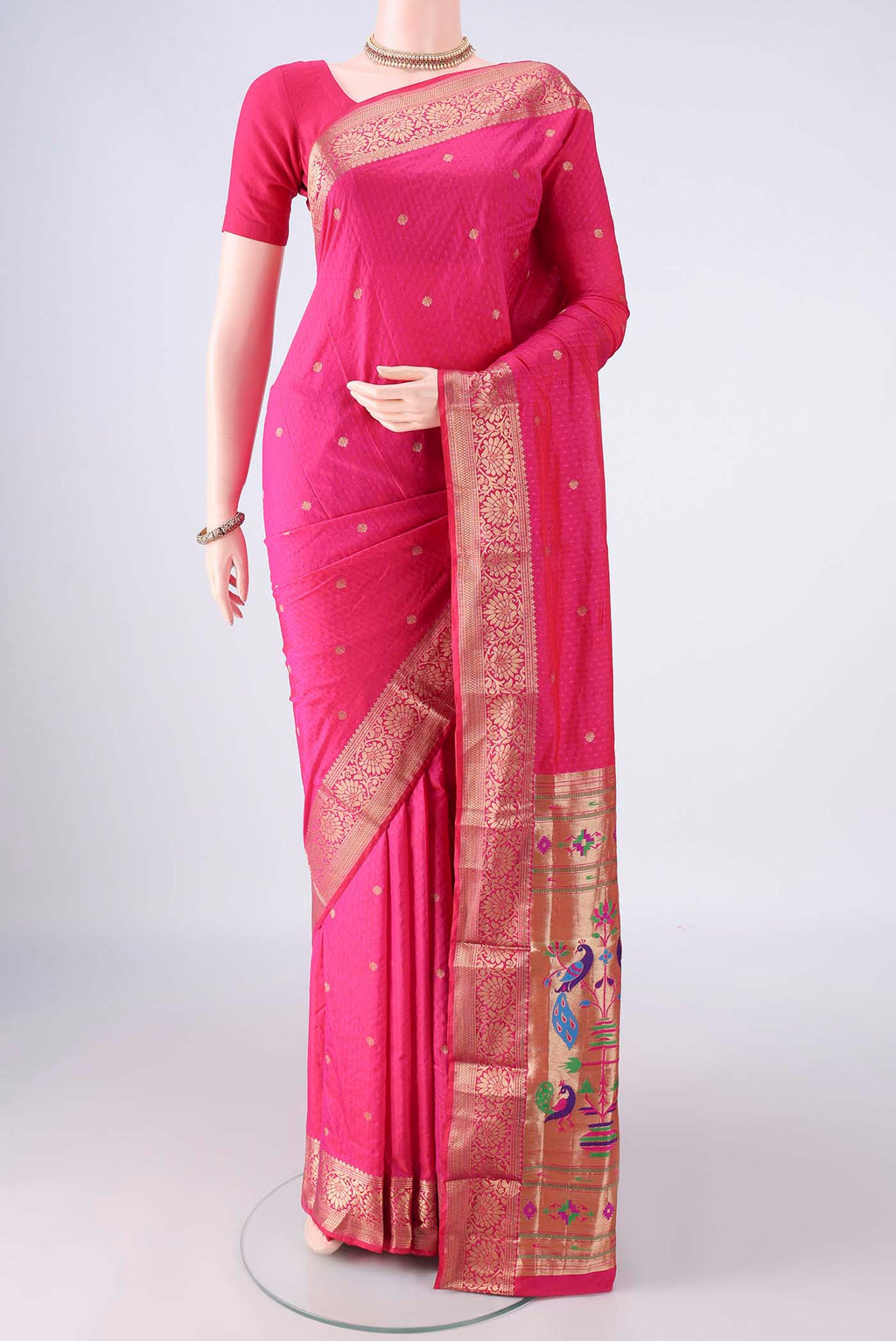 Rani Pink Blended Paithani Silk Saree with Jacquard design on the body and Zari Border.  displayed on a mannequin