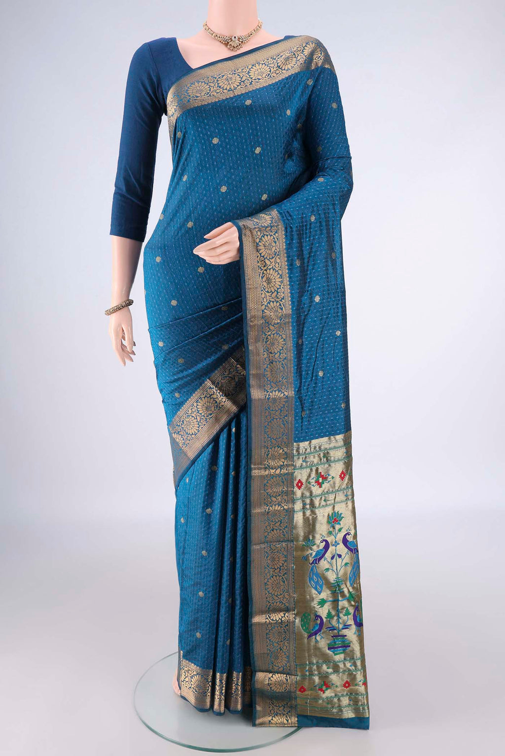 Blue Blended Paithani Silk Saree with Jacquard With Zari Butta on the body and Zari Border.  displayed on a mannequin