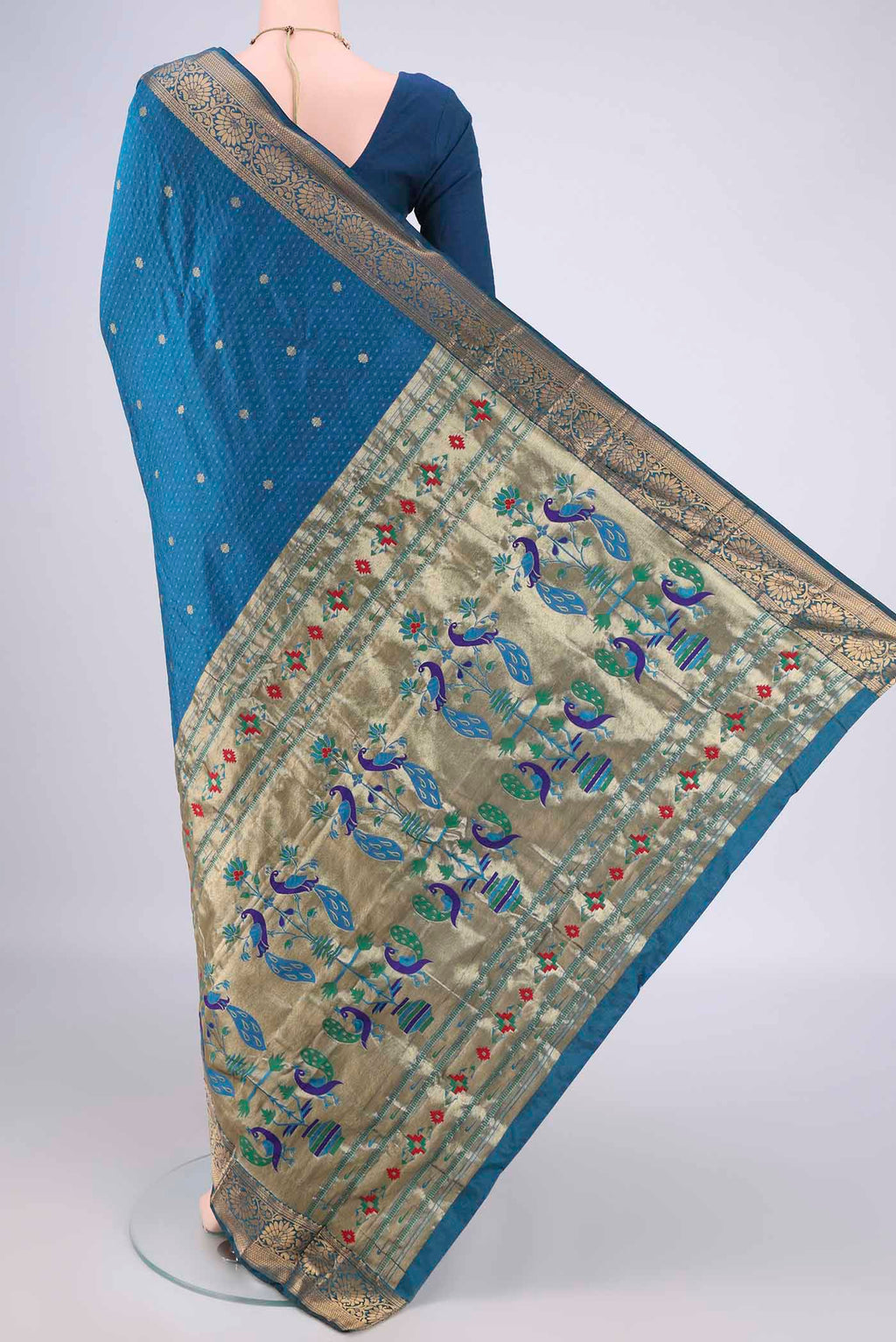 Flat view of Blue Blended Paithani Silk Saree with Jacquard With Zari Butta on the body and Zari Border. 
