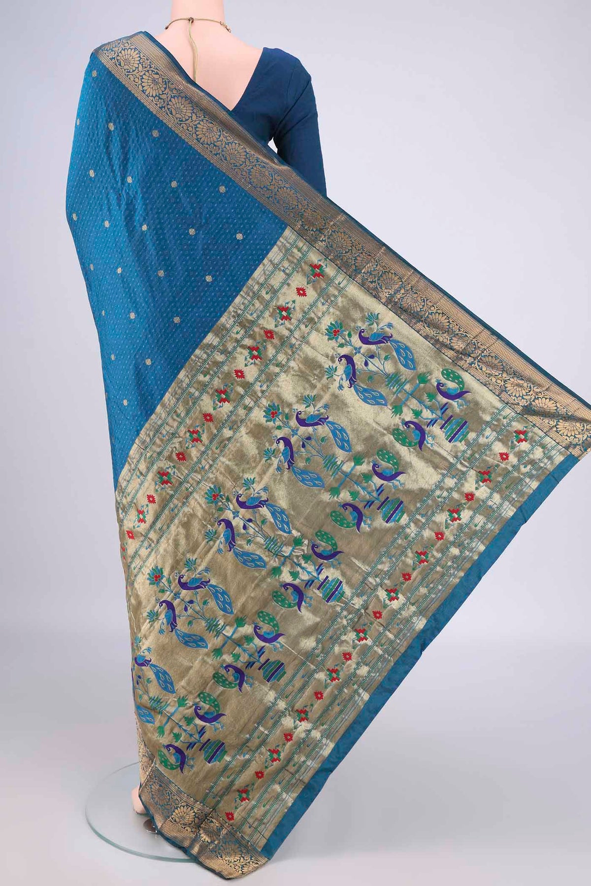 Flat view of Blue Blended Paithani Silk Saree with Jacquard With Zari Butta on the body and Zari Border. 