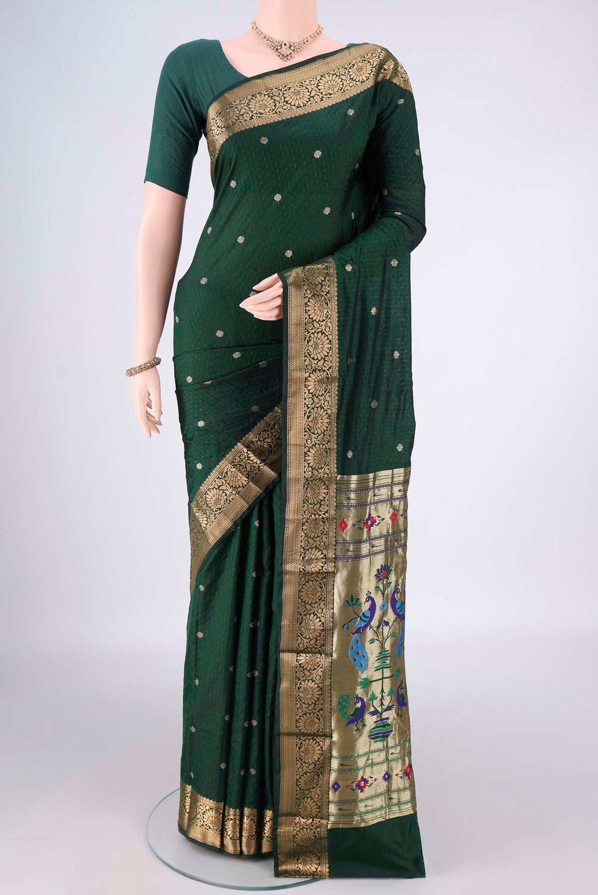 Bottle Green Blended Paithani Silk Saree with Jacquard With Zari Butta on the body and Zari Border.  displayed on a mannequin