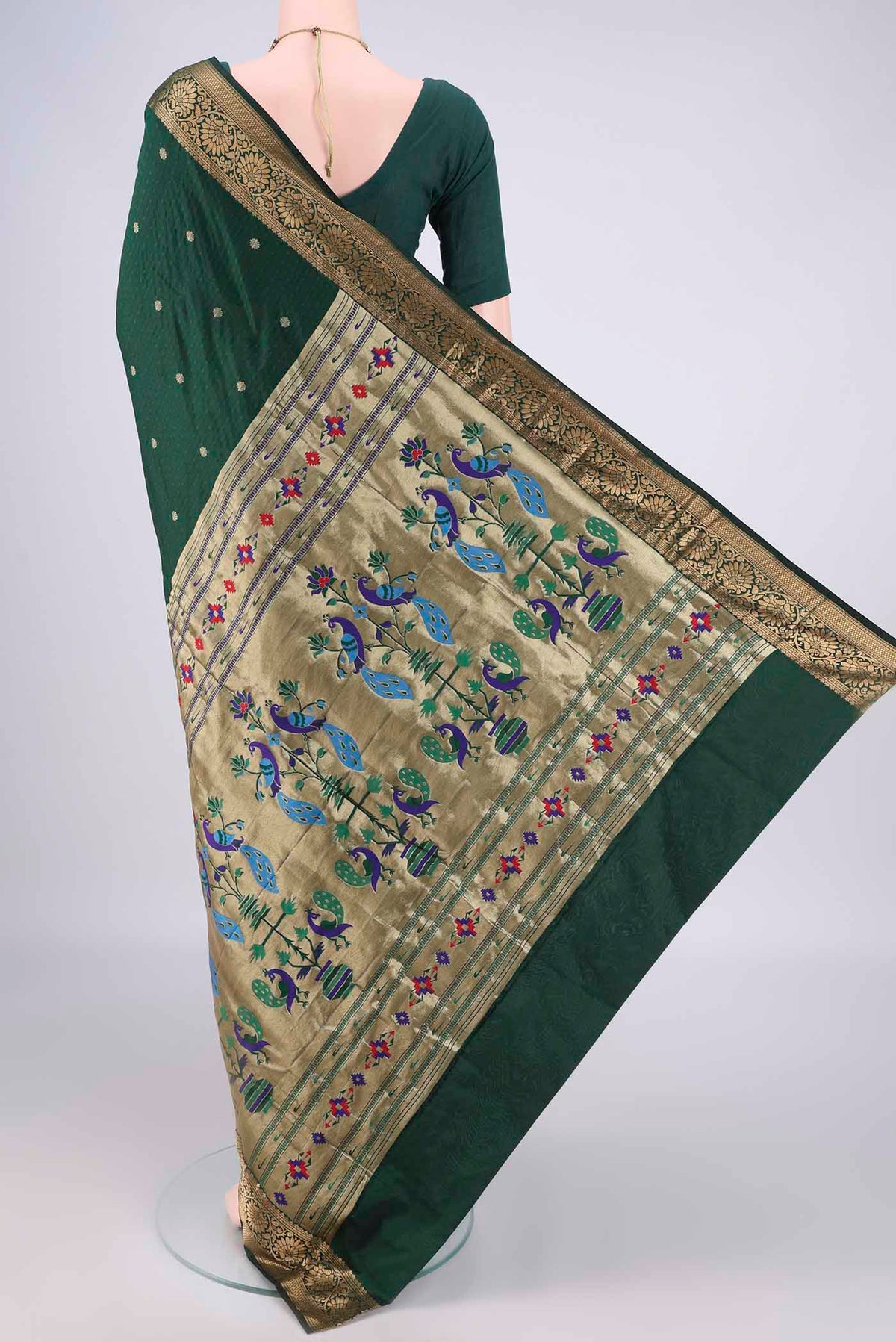 Flat view of Bottle Green Blended Paithani Silk Saree with Jacquard With Zari Butta on the body and Zari Border. 