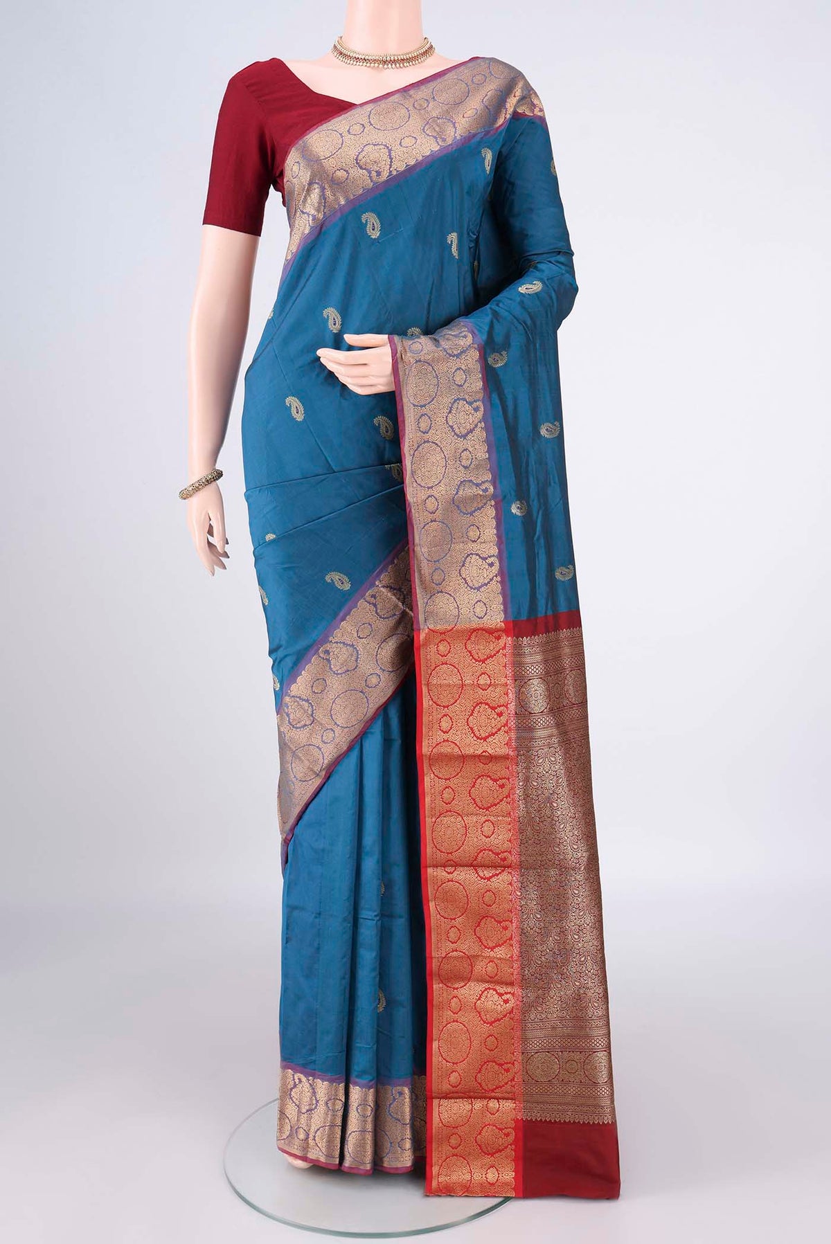 Blue Blended Bangalore Silk Saree with Zari Butta on the body and Zari Border.  displayed on a mannequin