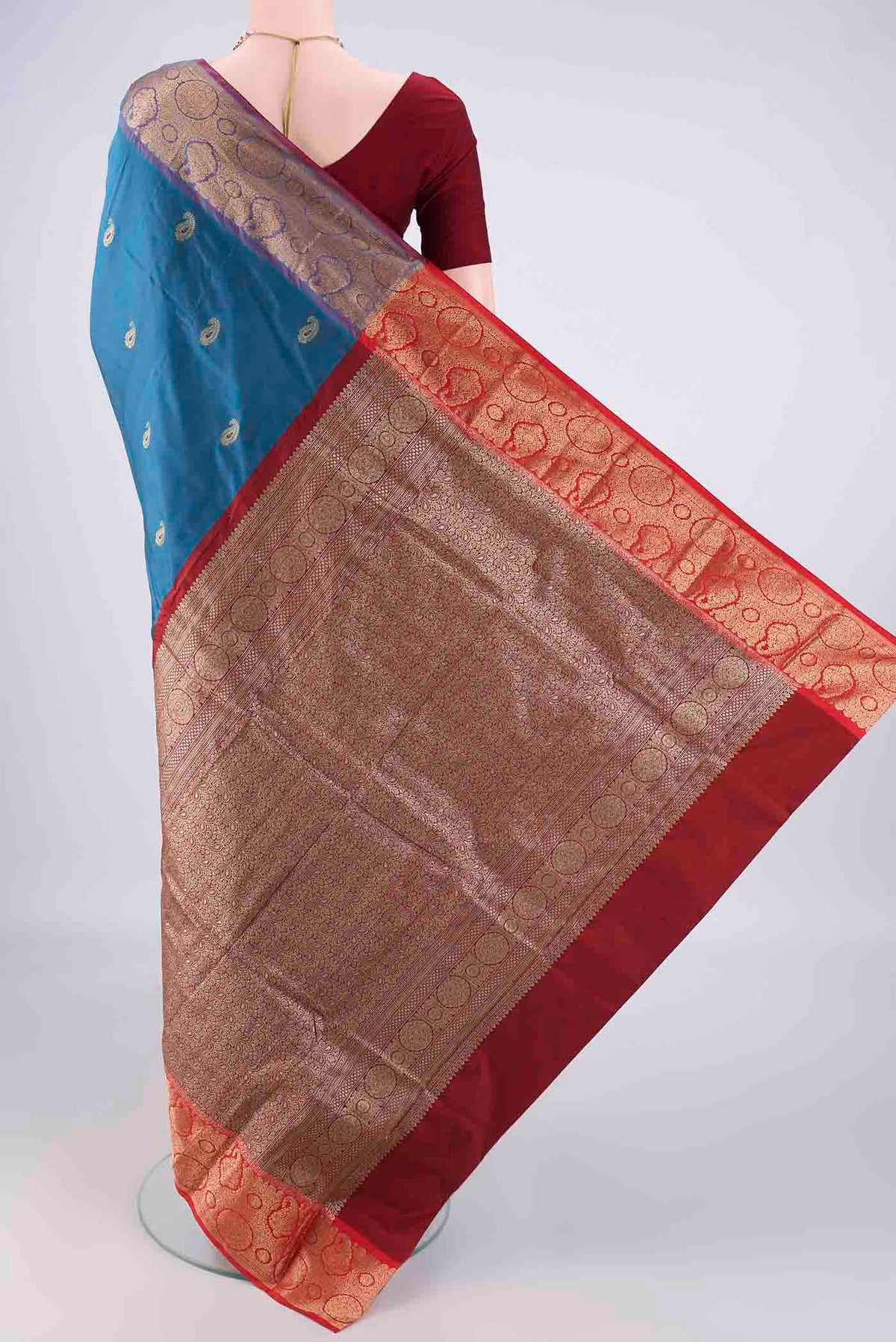 Flat view of Blue Blended Bangalore Silk Saree with Zari Butta on the body and Zari Border. 