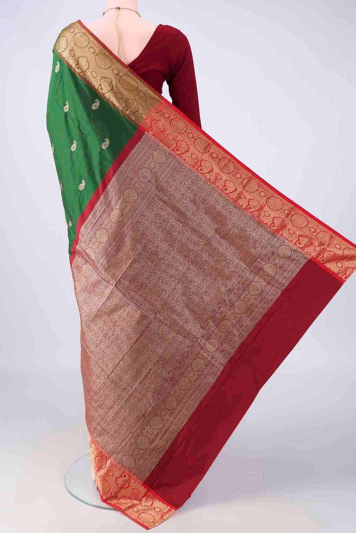 Flat view of Green Blended Bangalore Silk Saree with Zari Butta on the body and Zari Border. 