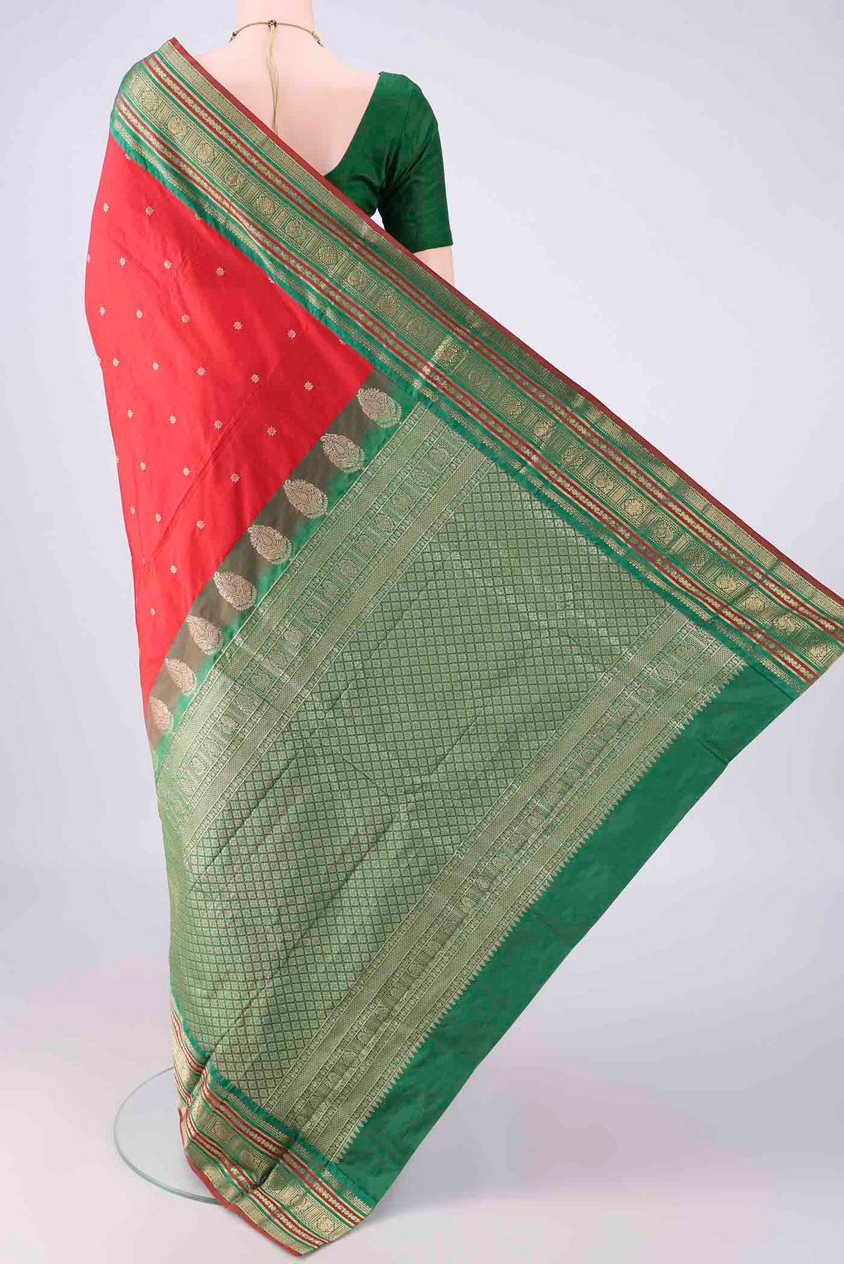 Flat view of Red Blended Bangalore Silk Saree with Zari Butta on the body and Zari Border. 