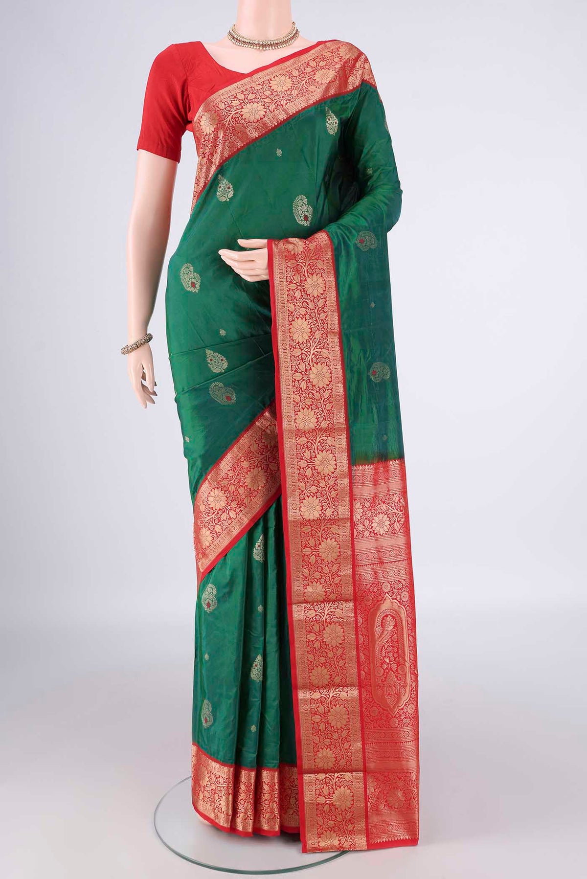 Green Blended Bangalore Silk Saree with Zari Butta on the body and Zari Border.  displayed on a mannequin