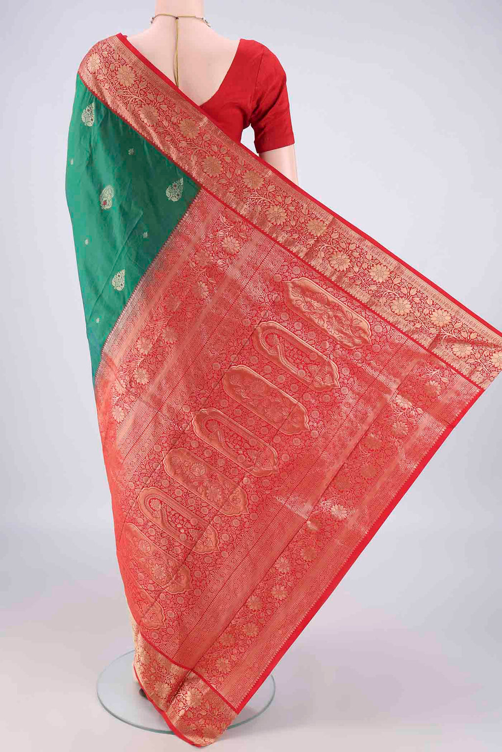 Flat view of Green Blended Bangalore Silk Saree with Zari Butta on the body and Zari Border. 