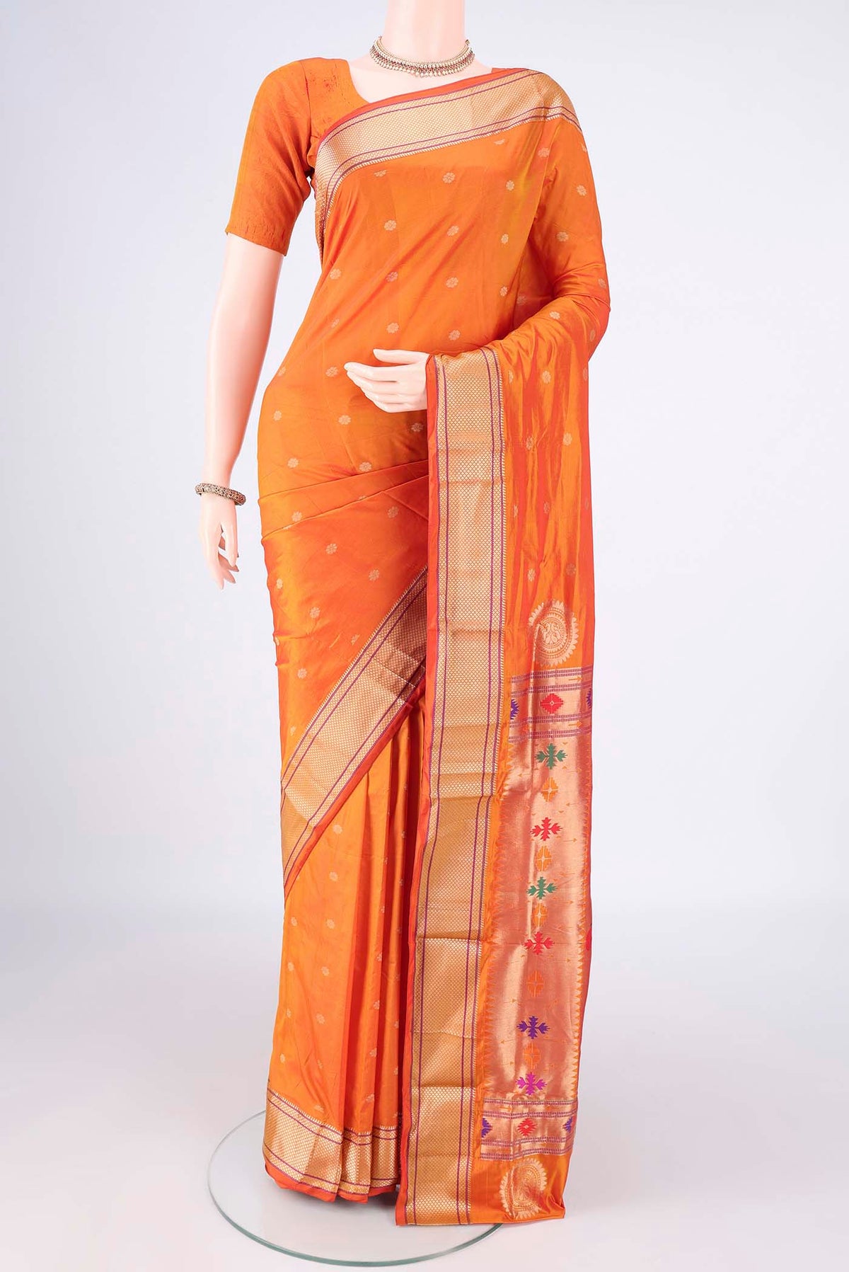 Brick Orange Dual Tone Blended Paithani Silk Saree with Zari Butta on the body and Zari Border.  displayed on a mannequin