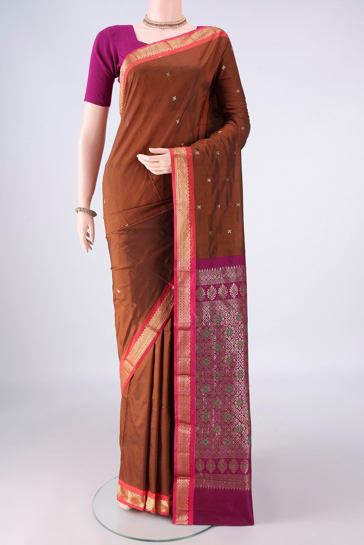 Bronze Blended Bangalore Silk Saree with Zari Butta on the body and Zari Border.  displayed on a mannequin