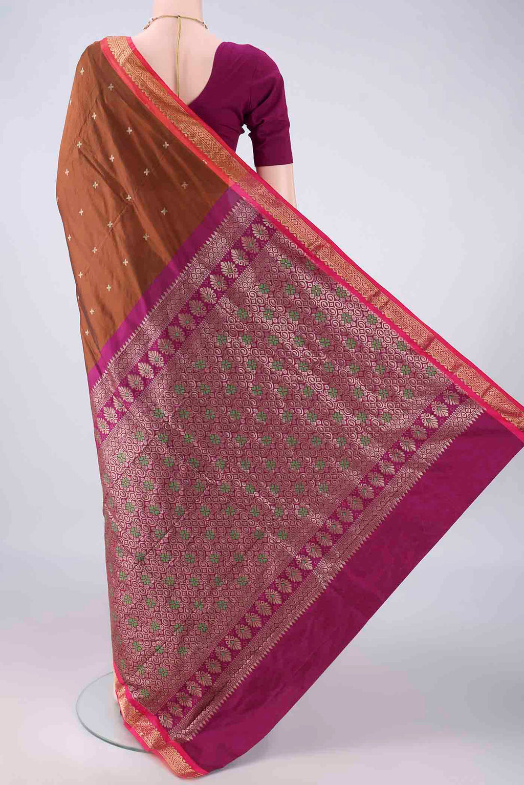 Flat view of Bronze Blended Bangalore Silk Saree with Zari Butta on the body and Zari Border. 