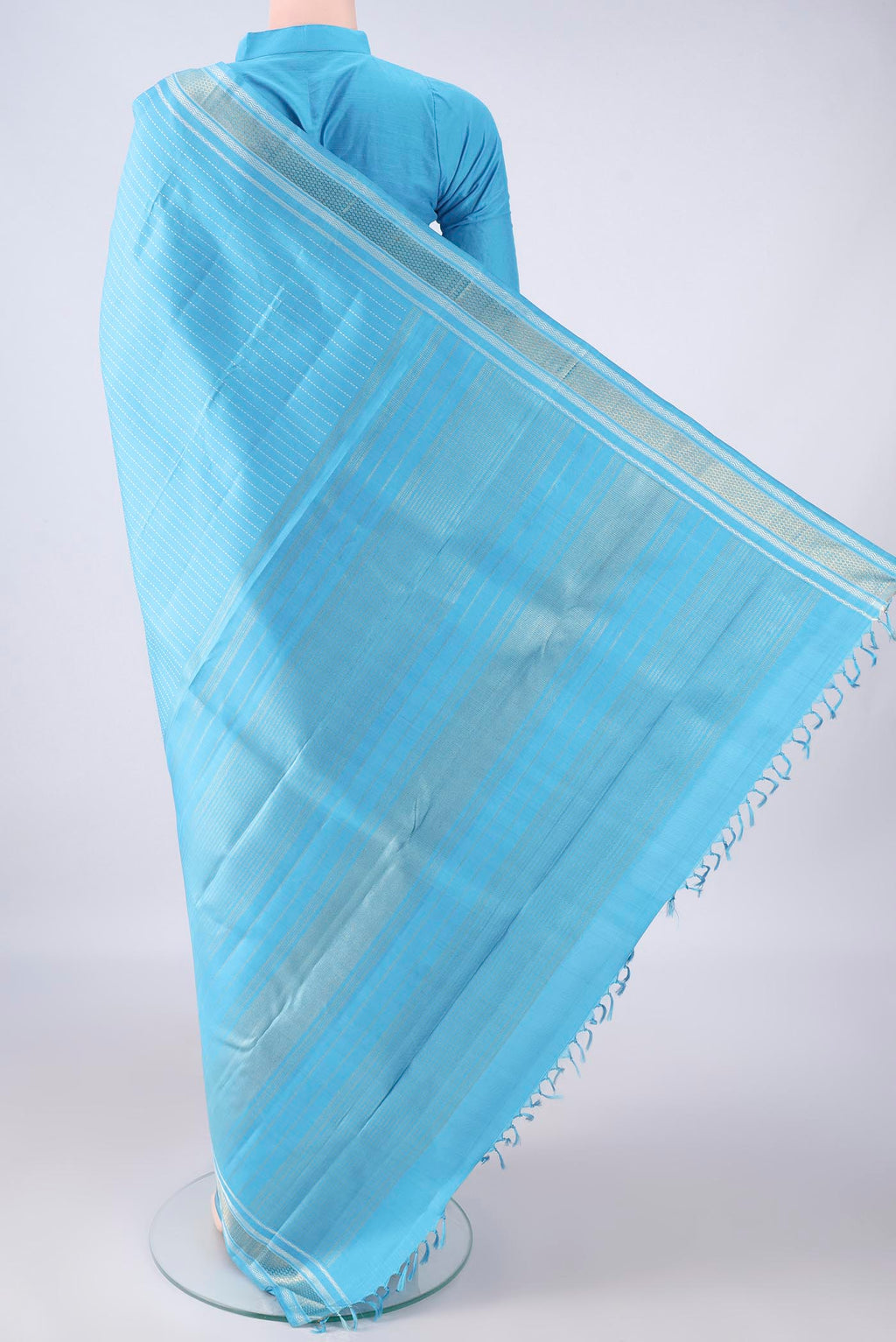 Flat view of Pure Silk Pure Zari Sky Blue Kanchipuram Saree with Stripes on the body and Zari Border. 