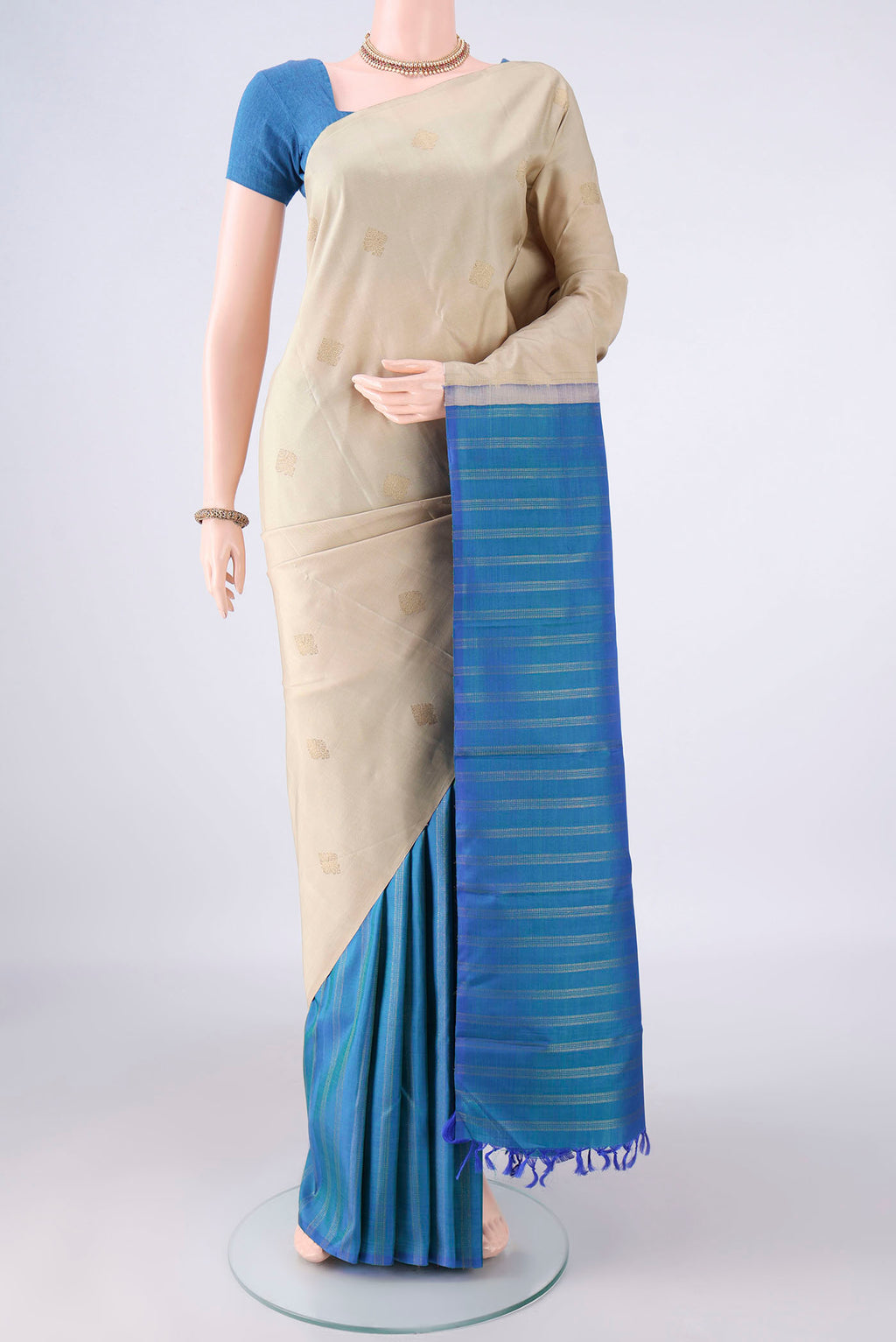 Pure Silk Multi Color Kanchipuram Saree with Half And Half on the body and Without Border.  displayed on a mannequin