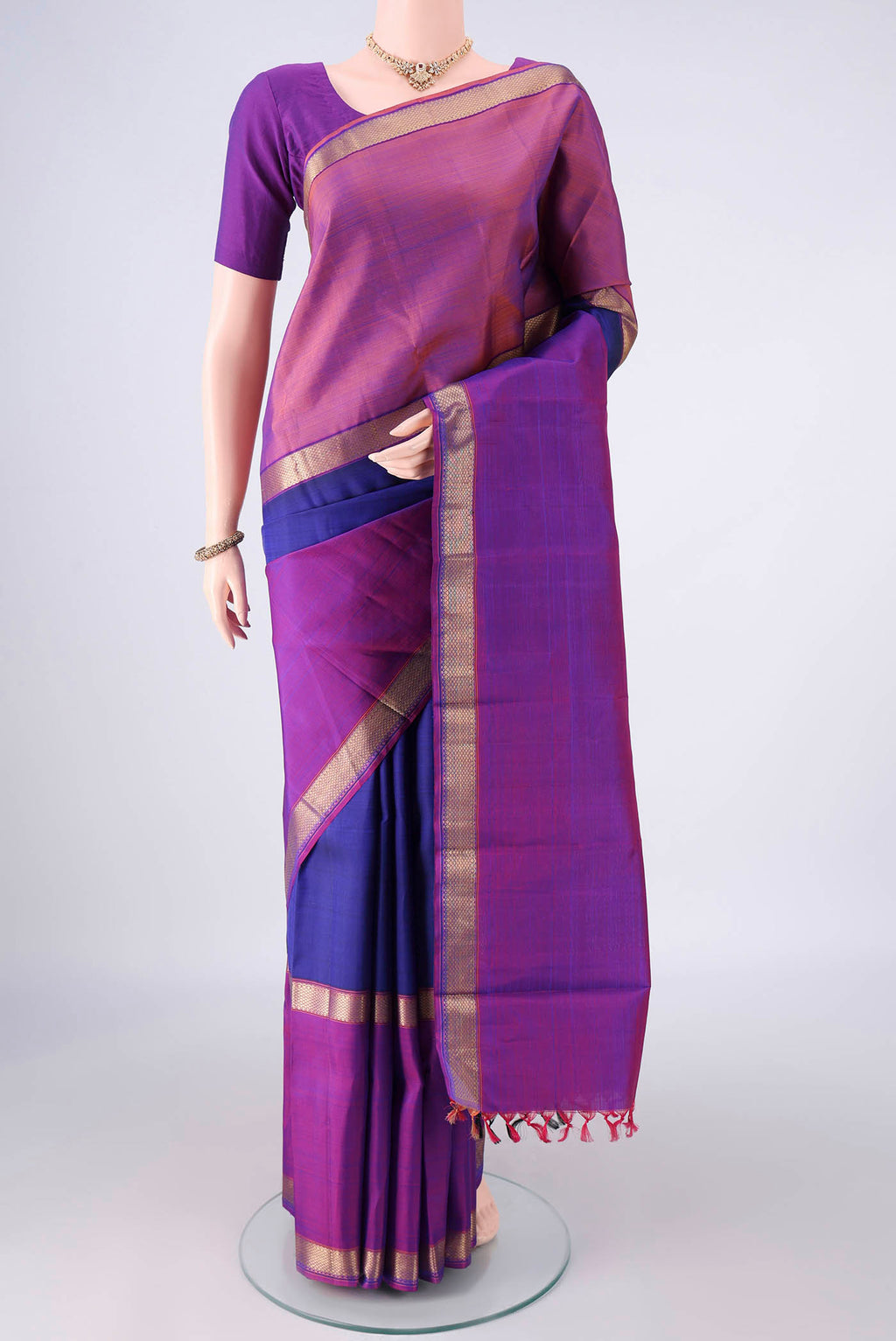 Pure Silk Royal Blue Kanchipuram Saree with Plain Body and Zari Border.  displayed on a mannequin