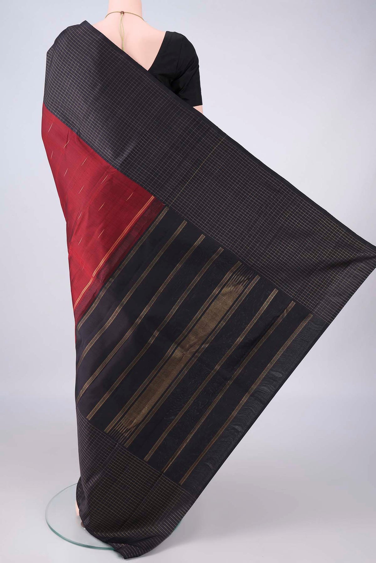 Flat view of Pure Silk Maroon Kanchipuram Saree with Zari Butta on the body and Checks Border. 
