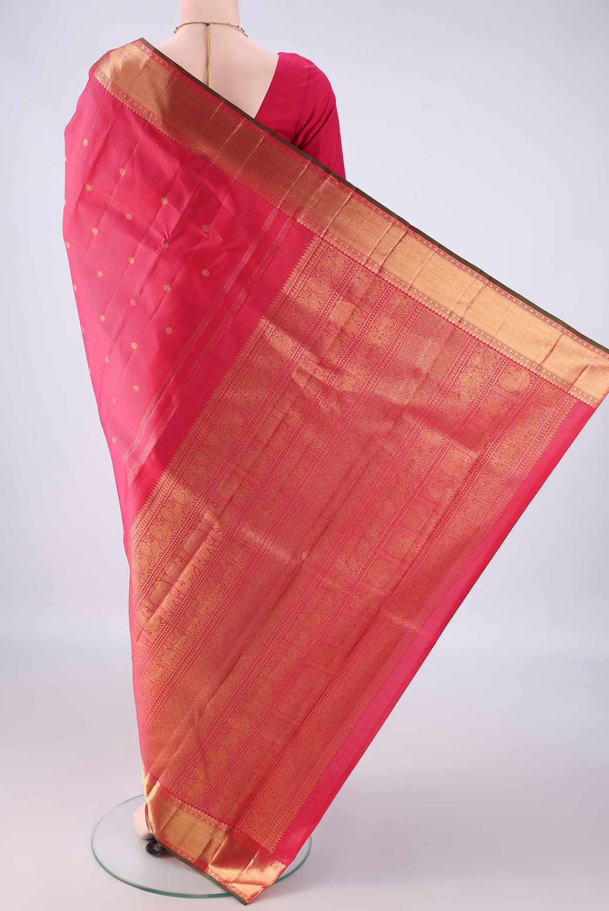 Flat view of Pure Silk Pure Zari Dark Pink Kanjivaram Saree with Zari Butta on the body and Zari Border. 